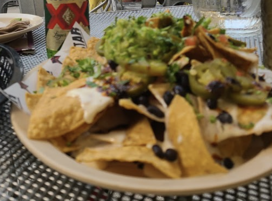 Big Star signature dishes Taco al Pastor
Big Star Nachos
Chips and Guacamole